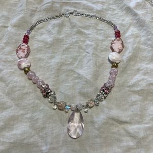 Pink and silver beaded crown with raindrop gem